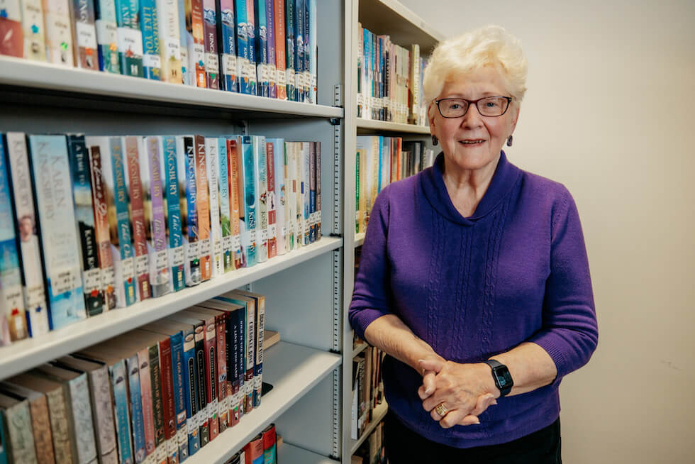 Woman volunteering to manage the library